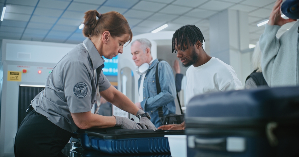tsa agent searching bag