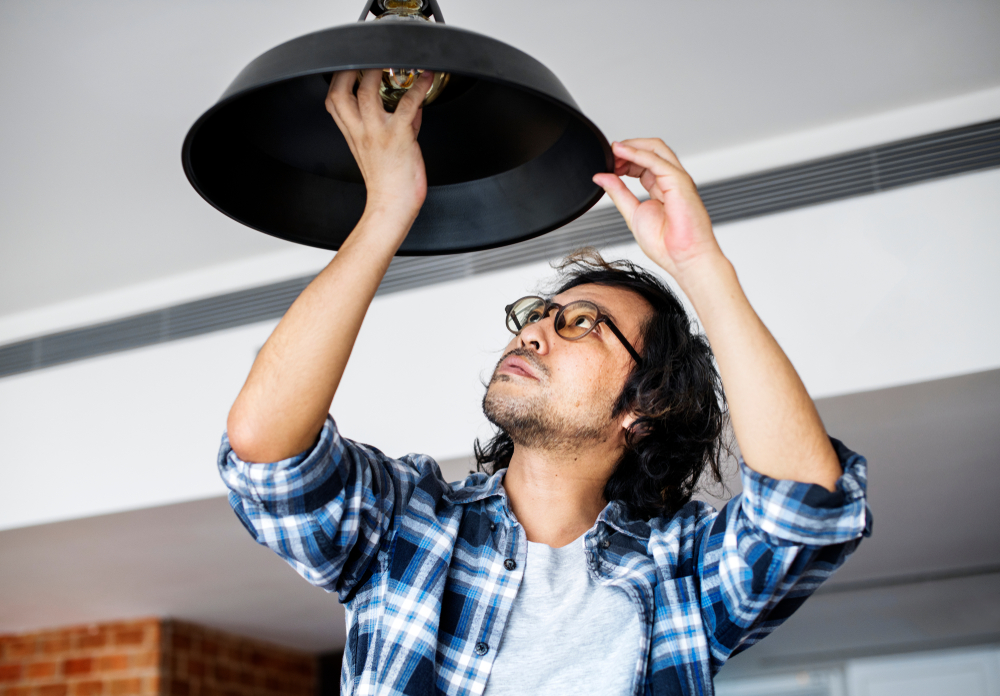 man changing lightbulb