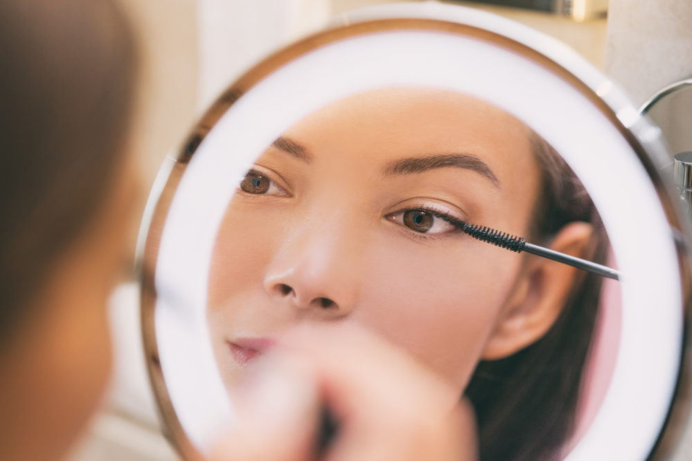 Woman applying makeup