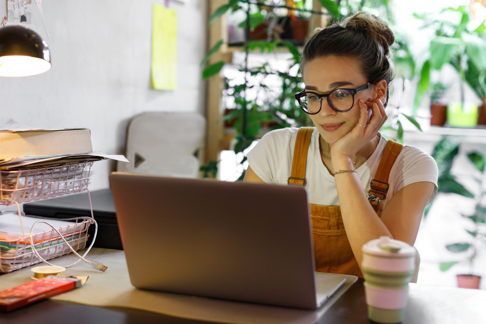 beautiful woman sitting at computer