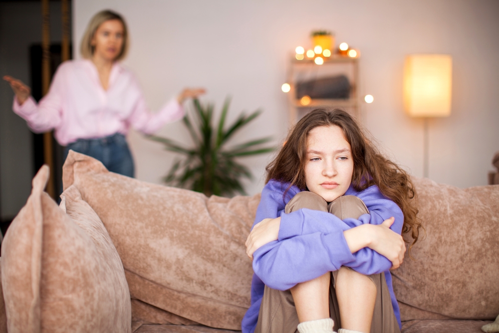 teenager sitting on couch