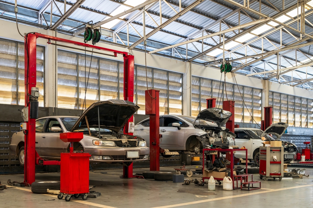 car repair in garage service station with soft-focus and over light in the background
